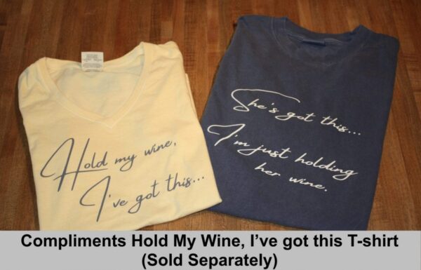 Hold my wine, I've got this... Short sleeve V-neck ladies t-shirt, She's got this...I'm just holding her wine. Short sleeve crew neck t-shirt