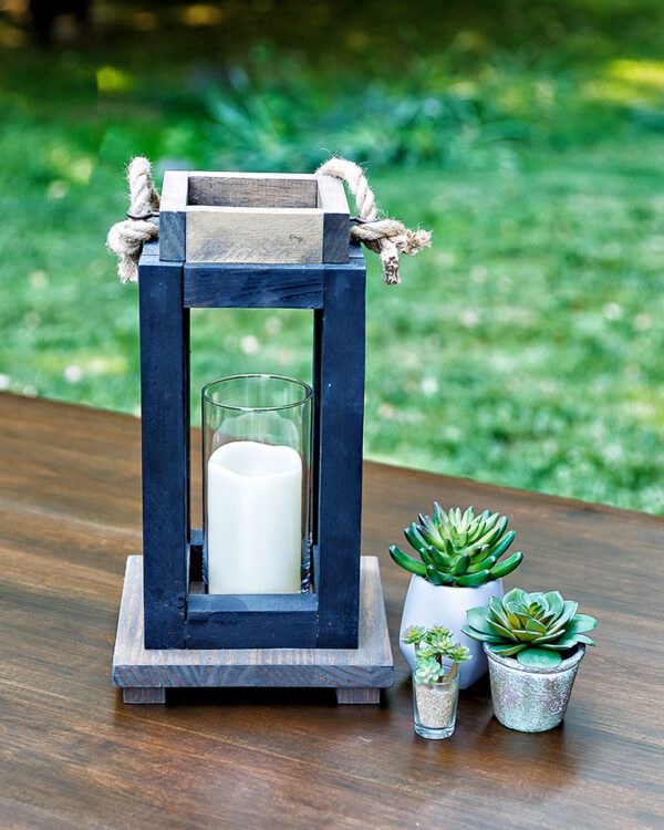 Wooden lantern with glass hurricane